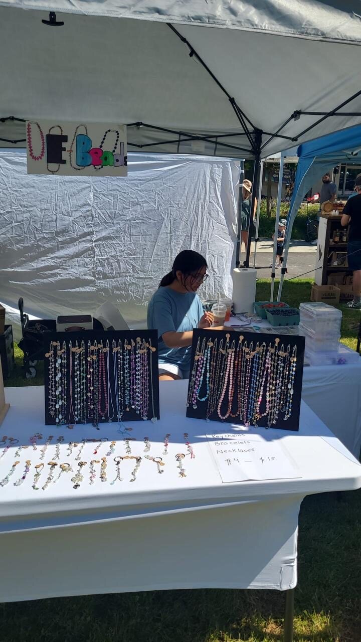 Eireen at her EBeads market stall with handmade jewellery displays